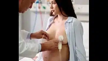 a sexy pregnant woman checked up by a doctor