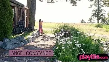 Slender sexy Asian MILF strips nude outdoors to flaunt perky tits