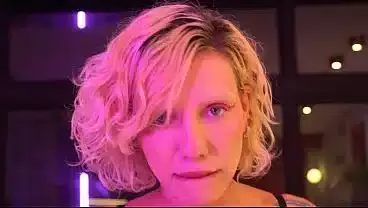Busty blonde gives a blowjob and handjob backstage
