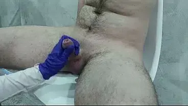 The nurse thoroughly massaged the patient’s testicles and penis to collect sperm for analysis.