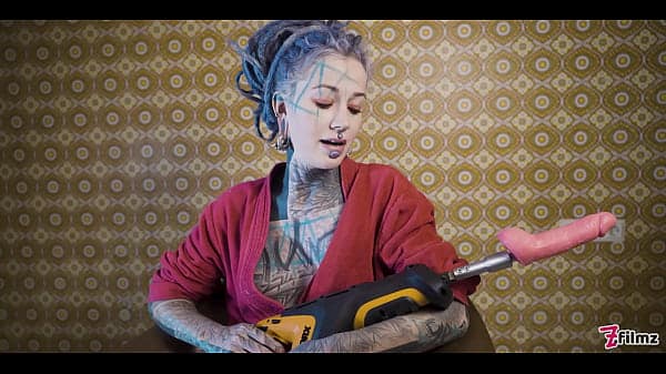 Ink-covered babe gets her ass wrecked by the fuck machine